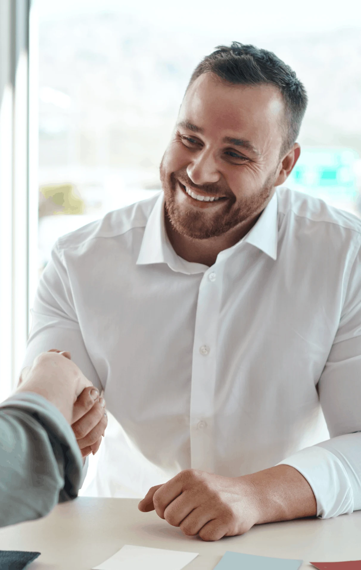 A man shaking the hand of a candidate he fulfilled a full-time job for.